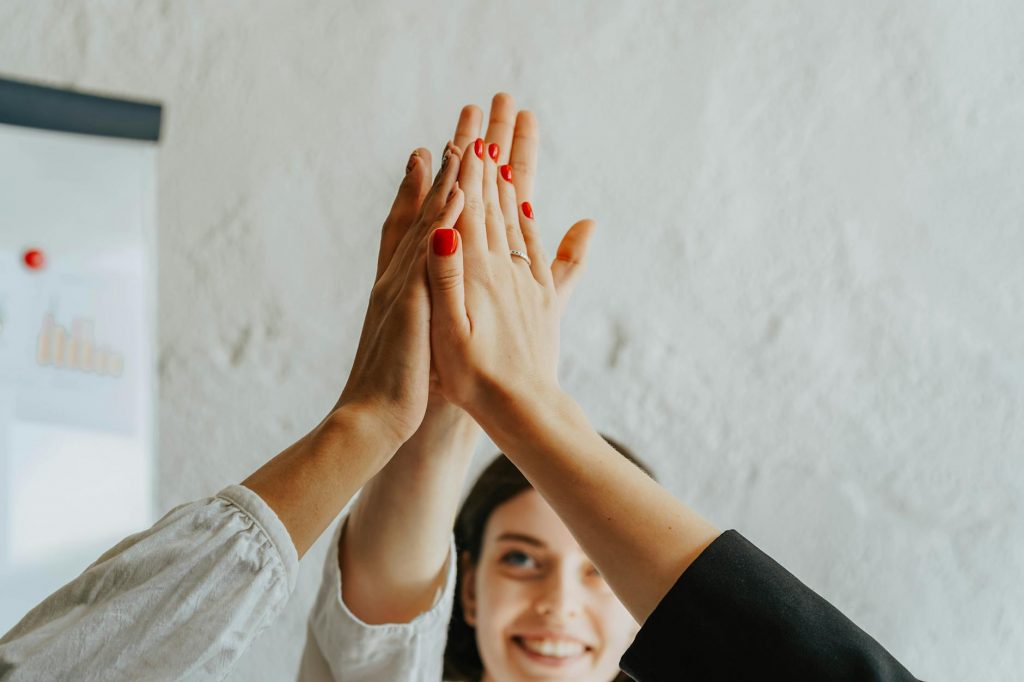 a group of people doing a high five